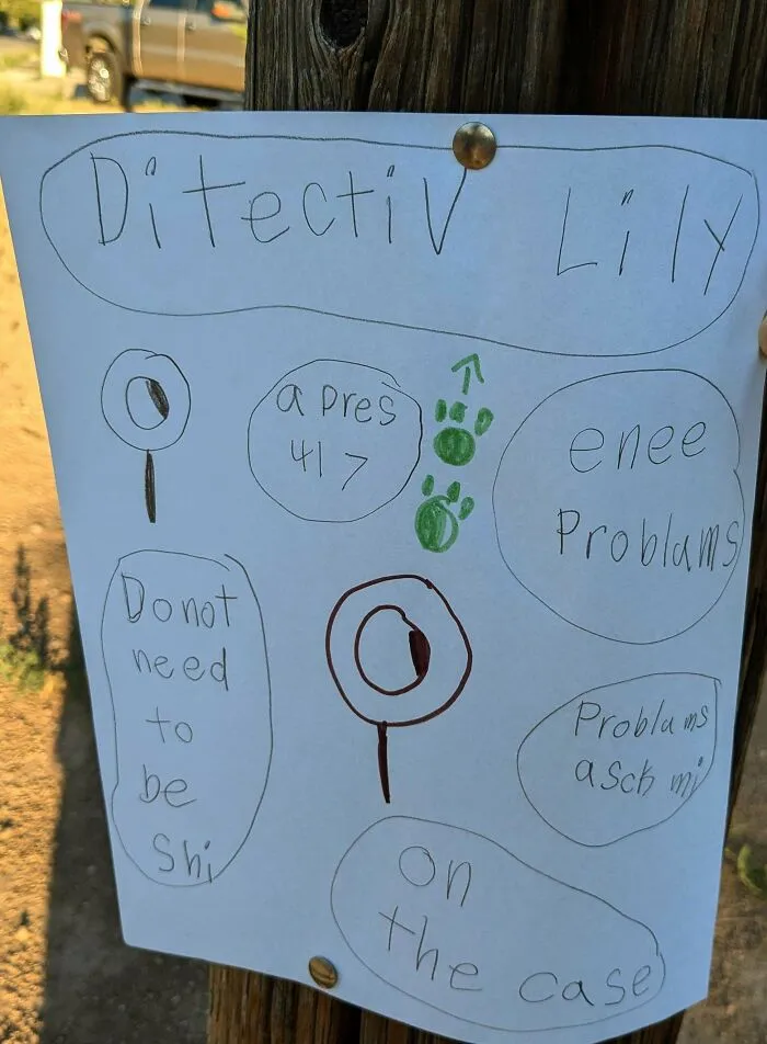 Handwritten detective-themed drawing on paper pinned to wooden post, a unique historical memento people randomly found outdoors.