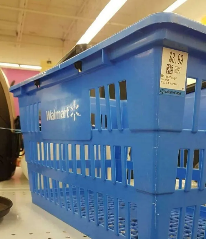Blue Walmart basket with a Value Village price tag showing a thrift store item priced at $3.99 on a store shelf.