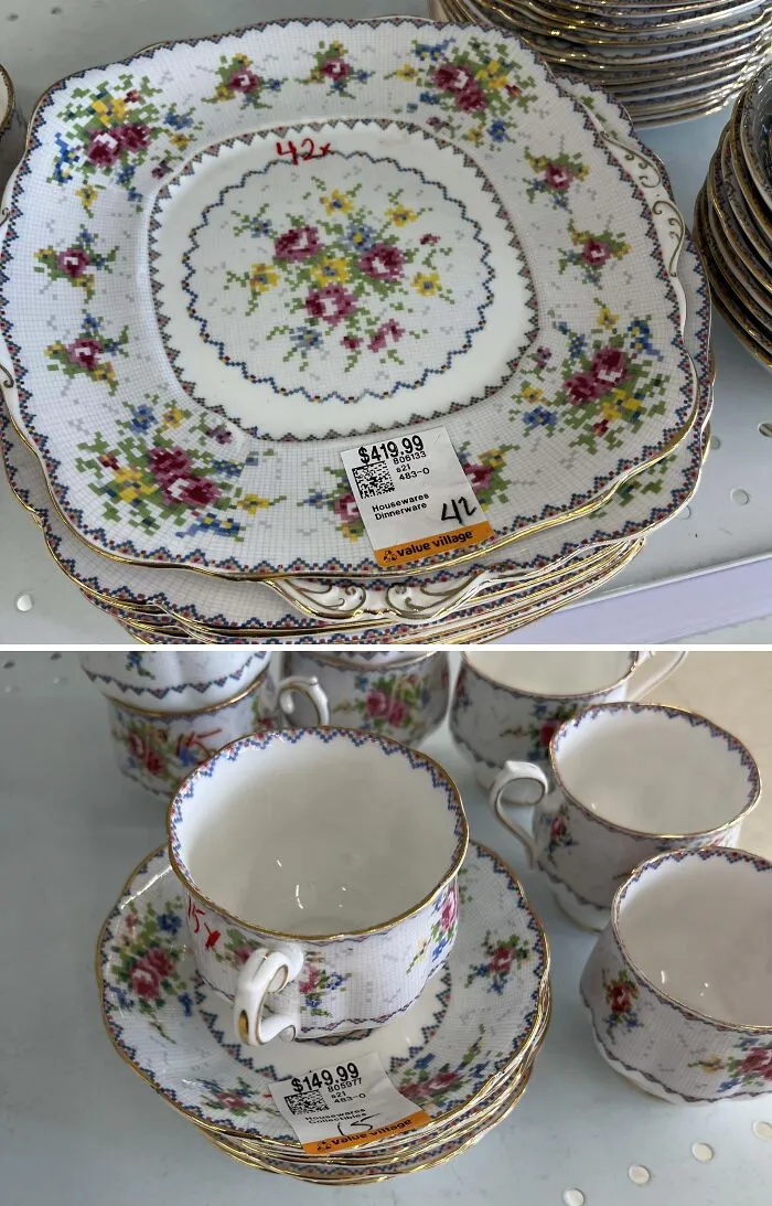 Stack of vintage floral dinnerware and teacups at thrift store with high price tags, an example of ridiculous thrift store finds.