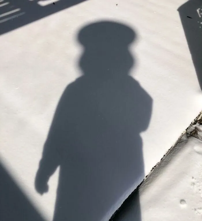 Shadow on snow creating a cool and interesting silhouette that made people look twice for its bizarre shape.