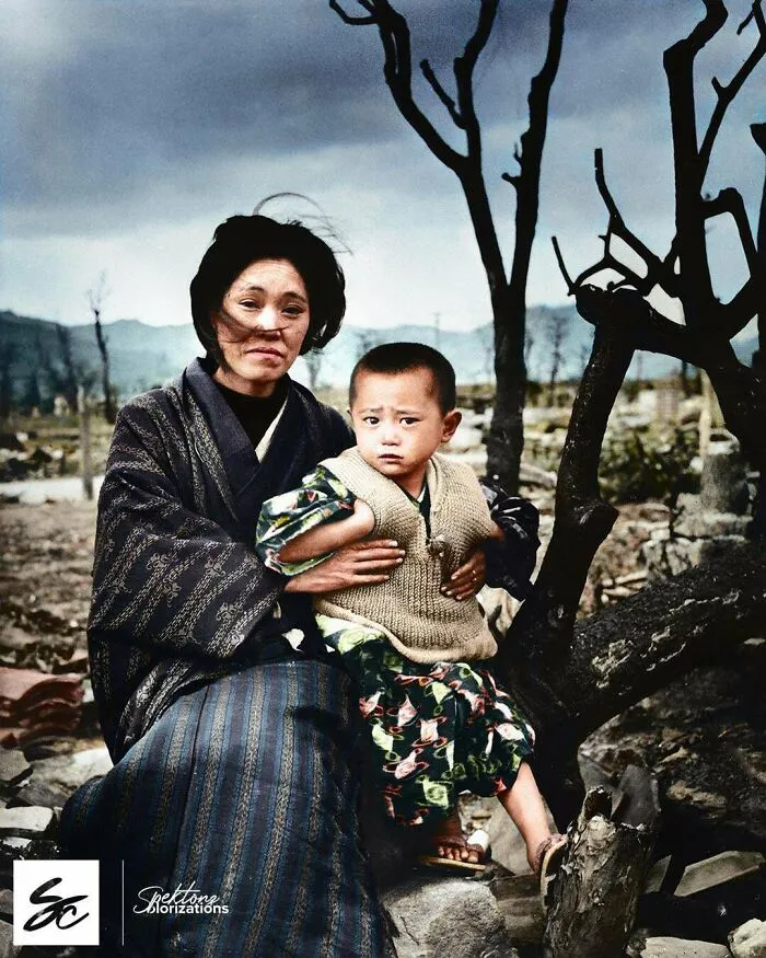 A Japanese Mother And Child, Dressed In Traditional Clothing, Siting Amid Rubble And Burnt Trees In Hiroshima, 4 Months After The Atomic Bomb Was Dropped. December, 1945 By Alfred Eisenstaedt
