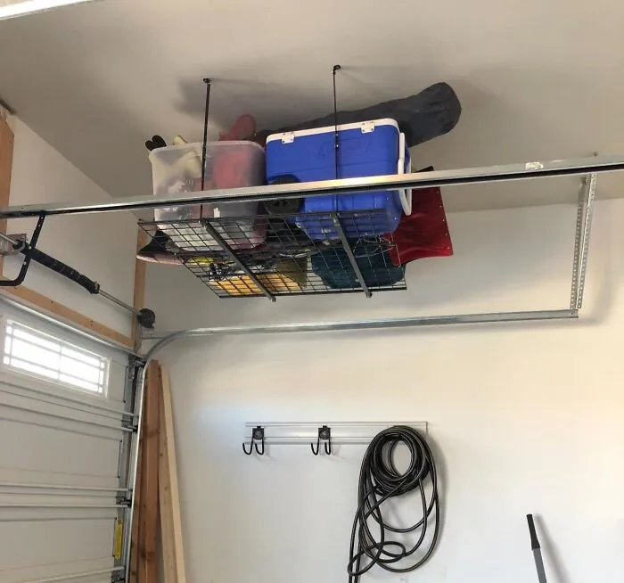 Your Garage Ceiling Is About To Go From 'Wasted Space' To 'Genius Storage Solution' For All Those Bulky Items Thanks To These <a Style="Display:inline;" Href="Https://Www.amazon.com/Hyloft-00625-Overhead-Organization-Hammertone/Dp/B004gho9fk?ie=utf8&th=1&linkcode=ll1&tag=bptapir-20&linkid=2e519aab67a847b21e625904db19be2a&language=en_us&ref_=as_li_ss_tl" Target="_blank"><span Style="Font: Inherit; Color: #d74b1f;"> Garage Roof Racks </Span>