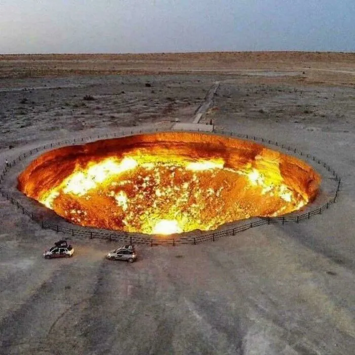 A massive burning crater in a desert landscape, showcasing one of the most fascinating content on the internet facts.