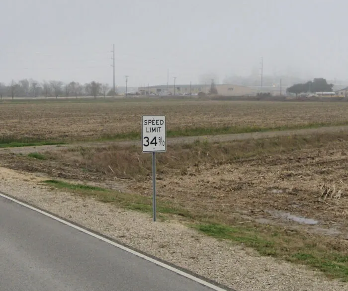 Unusual road with a speed limit sign showing 34 percent, one of the shenanigans captured on Google Maps.