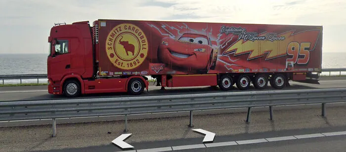 Red truck with a trailer featuring a Lightning McQueen design, one of the shenanigans captured on Google Maps.