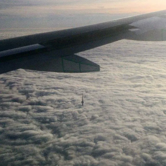 CN Tower Poking Out Of The Clouds On Approach Into Toronto