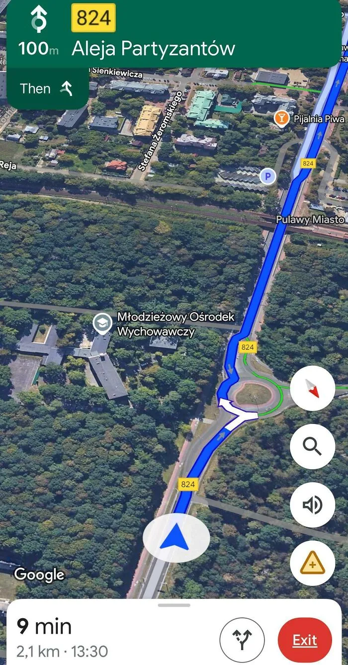 Google Maps navigation showing route with road signs and nearby buildings captured in a shenanigans moment on map.