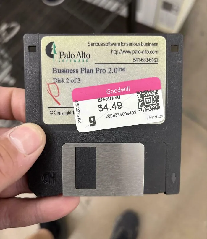 Floppy disk labeled Business Plan Pro 2.0 for sale at thrift store with price tag showing $4.49 from Goodwill.