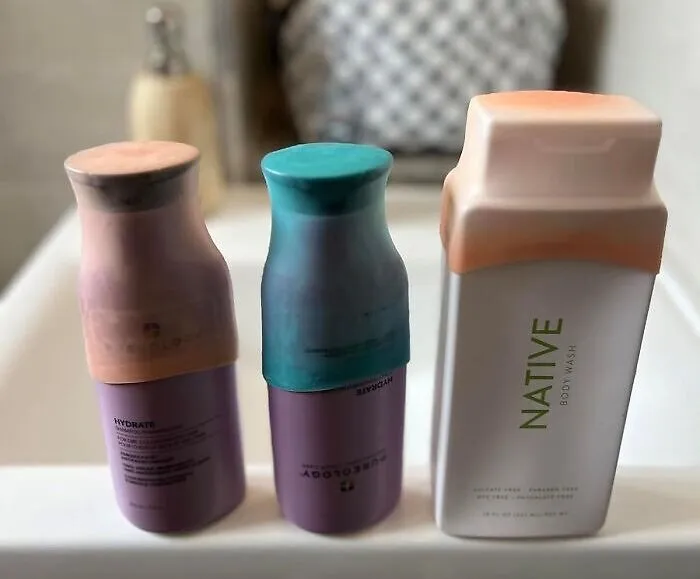 A Set Of <a Style="Display:inline;" Href="Https://Www.amazon.com/Proofing-Silicone-Accessories-Toiletries-Container/Dp/B0bq7pd5yw?ie=utf8&th=1&linkcode=ll1&tag=bpwalrus-20&linkid=41572cafc5398d256eb5b637e6cb1e46&language=en_us&ref_=as_li_ss_tl" Target="_blank">    <span Style="Font: Inherit; Color: #d74b1f;"> Silicone Bottle Covers For Traveling </Span> Can Finally Put An End To That Heart-Stopping Moment When You Open Your Suitcase And Pray A Shampoo Bomb Didn't Go Off