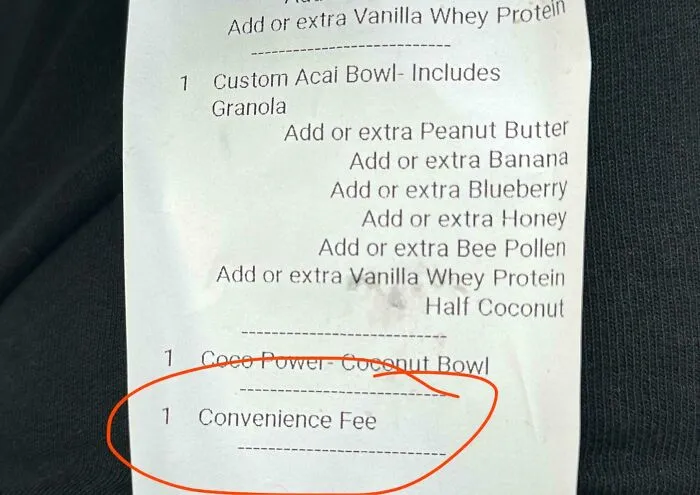 Receipt showing a convenience fee charged for a custom acai bowl, an example of ridiculous fees people complain about.