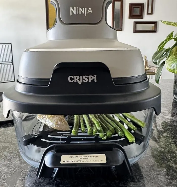 The Satisfying Journey From 'Sad Frozen Potato' To 'Gloriously Crispy Fry' Is Now A Spectator Sport With The <a Style="Display:inline;" Href="Https://Www.amazon.com/Ninja-Microwave-Dishwasher-Containers-Fn101gy/Dp/B0dddd8wd6?ie=utf8&th=1&linkcode=ll1&tag=bpcow-20&linkid=6255546092345864bdb30f6d3aedaf67&language=en_us&ref_=as_li_ss_tl" Target="_blank"> <span Style="Font: Inherit; Color: #d74b1f;"> Crispi 4-In-1 Portable Glass Air Fryer </Span>