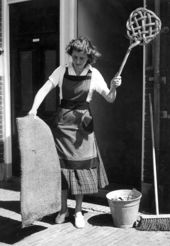 Housewife Cleaning Doormat With Carpet-Beater, The Netherlands, 1955