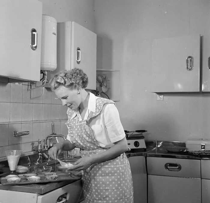 Housewife In Model Kitchen Making A Cake, 1953