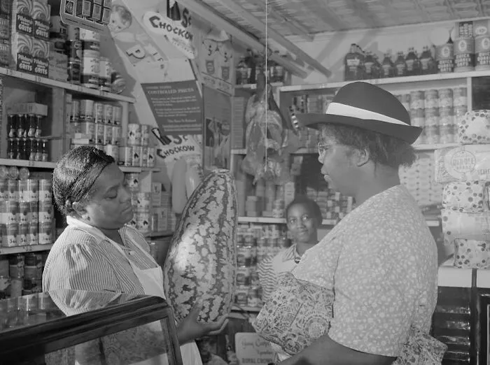 Housewife Bargaining In The Store Owned By Mr. J. Benjamin, Washington, D.c., 1942