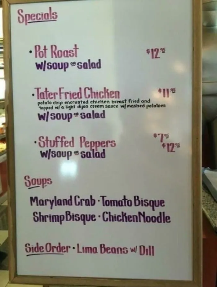 Restaurant specials menu board showing handwritten perfect handwriting examples with clear prices and dishes listed.