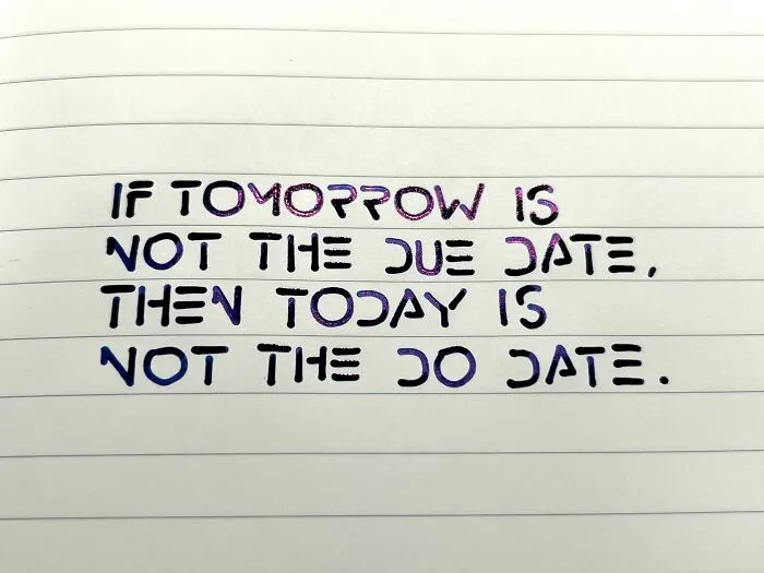 Handwriting example with neatly written motivational quote on lined paper showcasing perfect handwriting style.