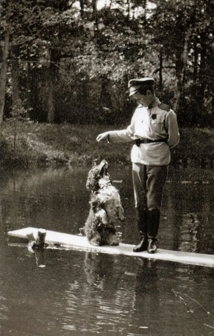 Tsarevich Alexei Romanov Playing With His Dog Joy In 1917. On July 17, 1918, Alexei And His Family Were All M******d And Joy Was The Only Survivor