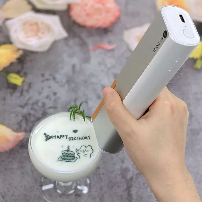 If Your 'For You Page' Is Full Of Latte Art That Makes You Feel Wildly Untalented, This <a Style="Display:inline;" Href="Https://Www.amazon.com/Evebot-Handheld-Printpen-Portable-Bluetooth/Dp/B0dsfcxmbh?crid=2kx70ewqjtqk3&keywords=viral%2bhobby%2bfinds&qid=1750246381&sprefix=viral%2bhobby%2bfinds%2caps%2c251&sr=8-2-Spons&sp_csd=d2lkz2v0tmftzt1zcf9hdgy&th=1&linkcode=ll1&tag=bpbuffalo-20&linkid=791a2cc955d680de394603df6588418d&language=en_us&ref_=as_li_ss_tl" Target="_blank"><span Style="Font: Inherit; Color: #d74b1f;"> Latte Foam Art Print Pen </Span> Is Here To Level The Caffeinated Playing Field