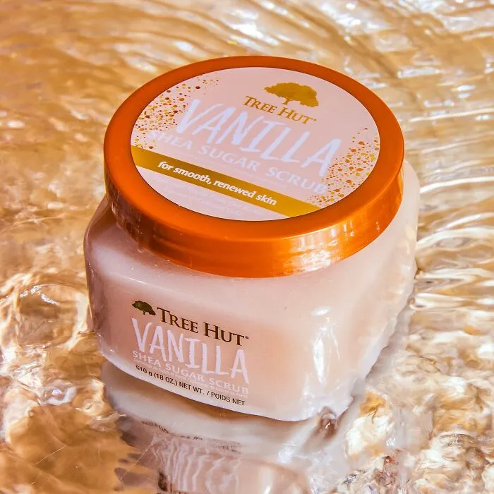 Tree Hut vanilla shea sugar scrub jar with orange lid on reflective surface, trending Pandaverse product.