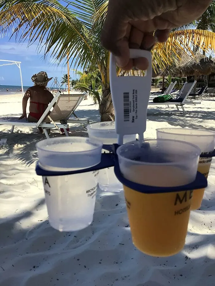 Juggling Multiple Beach Beverages Like A Caffeinated Octopus Is No Longer Your Destiny Thanks To This Ridiculously Handy <a Style="Display:inline;" Href="Https://Www.amazon.com/Carryaround-Take-Out-Beverage-Reusable-Festival/Dp/B00ujd3d2k?ie=utf8&th=1&linkcode=ll1&tag=bpowl-20&linkid=ce11c1036c9fc4af7419d791d932a3fc&language=en_us&ref_=as_li_ss_tl" Target="_blank"><span Style="Font: Inherit; Color: #d74b1f;"> Fold Away Cup Carrier</Span>