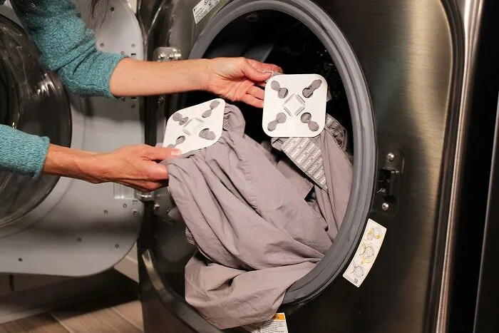 Because Doing Laundry On Your Own Is Already A Character-Building Experience, This <a Style="Display:inline;" Href="Https://Www.amazon.com/Dp/B08dmdt7df?ascsubtag=7886467%2c18%2c27%2cd%2c0%2c0%2cbf-Shp-Hf%2c1396%3a1%3b900%3a2%3b974%3a1%3b1338%3a1%2c63704260%2c0%2c0%2c0&btn_ref=srctok-D87017fb3bc345fb&th=1&linkcode=ll1&tag=bpsparrow-20&linkid=7df46ee1d5fb0d918e5b7d1954090dd5&language=en_us&ref_=as_li_ss_tl" Target="_blank"><span Style="Font: Inherit; Color: #d74b1f;"> Wad-Free Bed Sheet Detangler</Span> Prevents Your Dryer From Turning Your Sheets Into An Angry, Tangled Monster