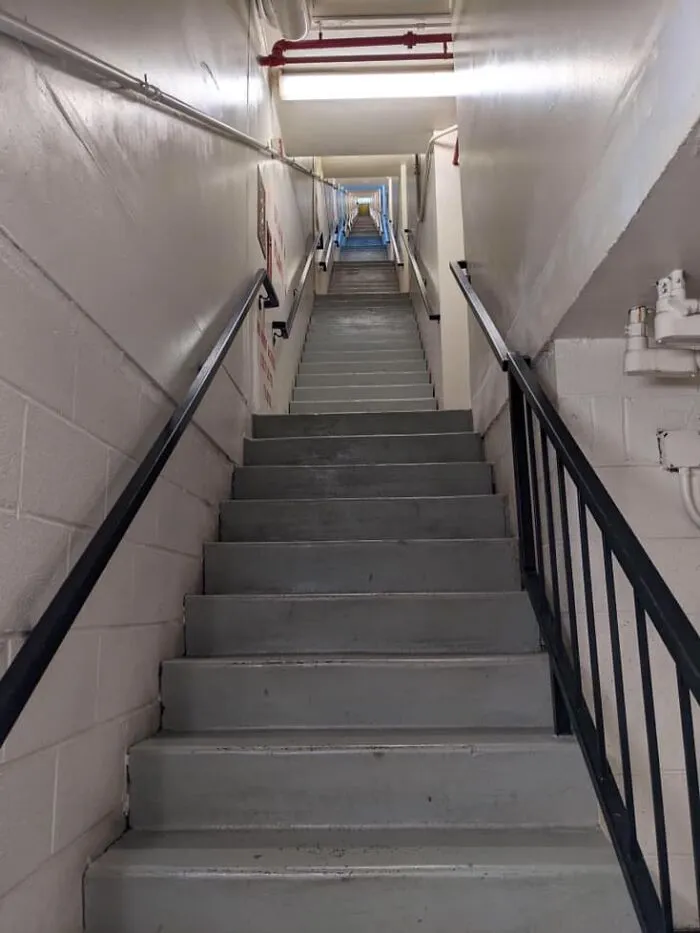 Ayo, The Pizza’s Here! Image Description: A Flight Of Stairs That Goes Straightforward For 13 Stories Without Turning