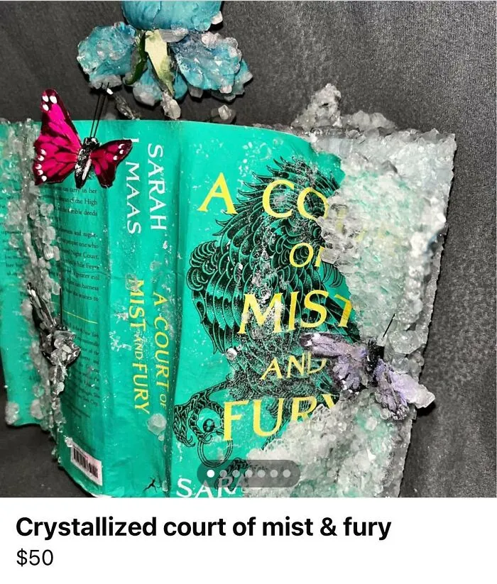 Crystallized DIY craft project of a book covered in crystals with decorative butterflies, showcasing craft shaming fails.