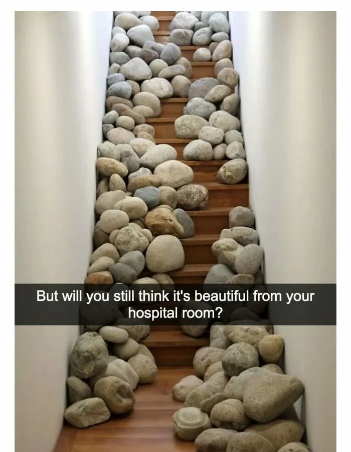 A Wood Staircase Is Covered With Decorative Stones Leaving Only A Narrow And Snaking Path For The User