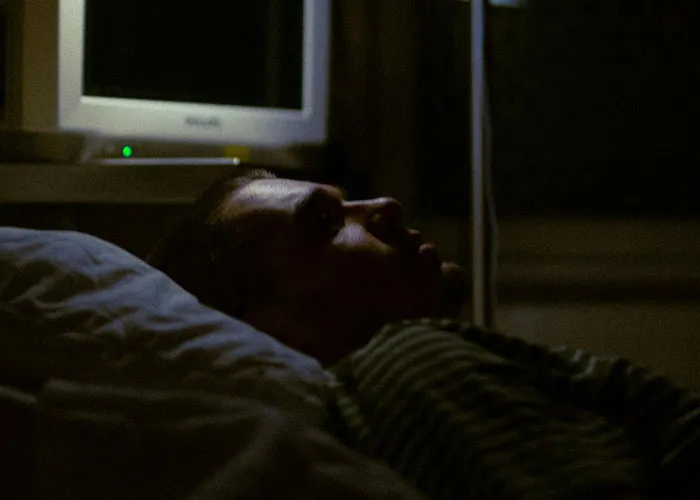 Man lying awake in the dark, reflecting on why they called off their engagement after a betrayal by the best man.