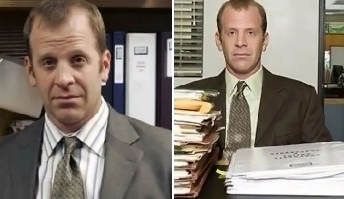 Man in business suit sitting in office surrounded by files and documents representing fascinating content on the internet facts