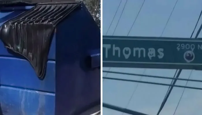Blue dumpster with partially open lid next to a street sign for Thomas, illustrating fascinating and interesting facts on the internet.