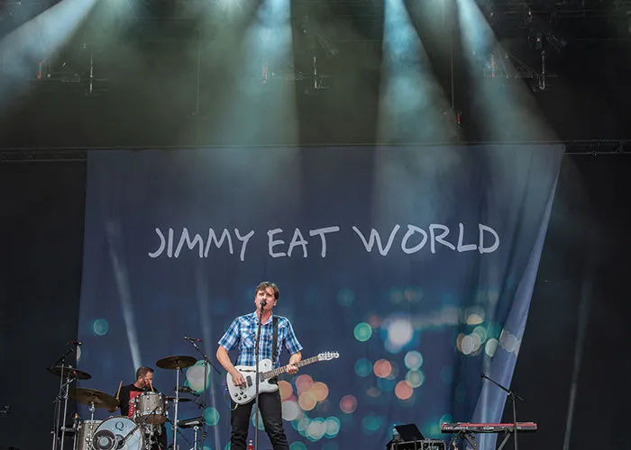 Band performing live on stage with fans sharing unbelievable experiences they can prove.