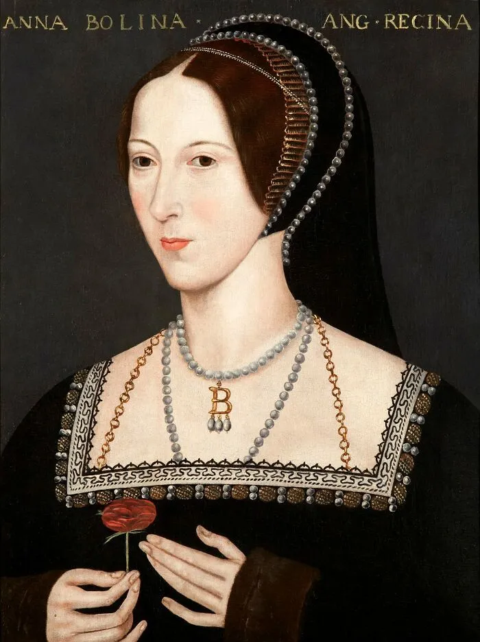 Portrait of Anne Boleyn holding a red flower, showcasing famous names from history known for being good looking.