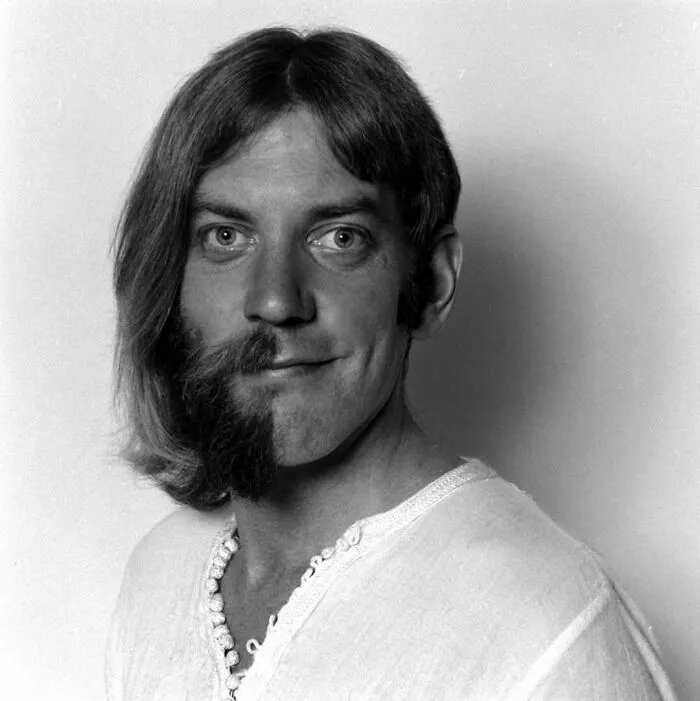 Close-Up Portrait Of Canadian Actor Donald Sutherland As He Poses, Half Clean-Shaven And Half With Chin-Length Hair, New York, 1970