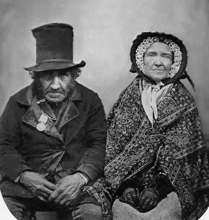 Black and white photo of an elderly man and woman in vintage clothing showcasing weird things about history.