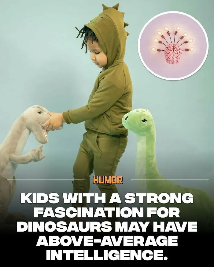 Child dressed as dinosaur playing with dinosaur toys, illustrating brain and knowledge fact about intelligence and fascination.