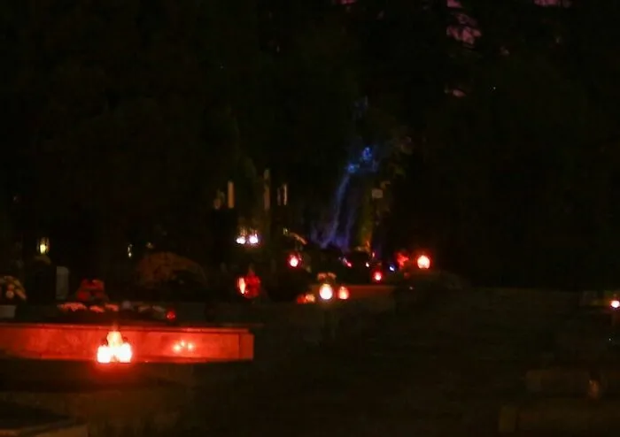 Took A Photo Of A Cemetery, Then Zoomed In... Well That Blue Thing Seems To Have A Face