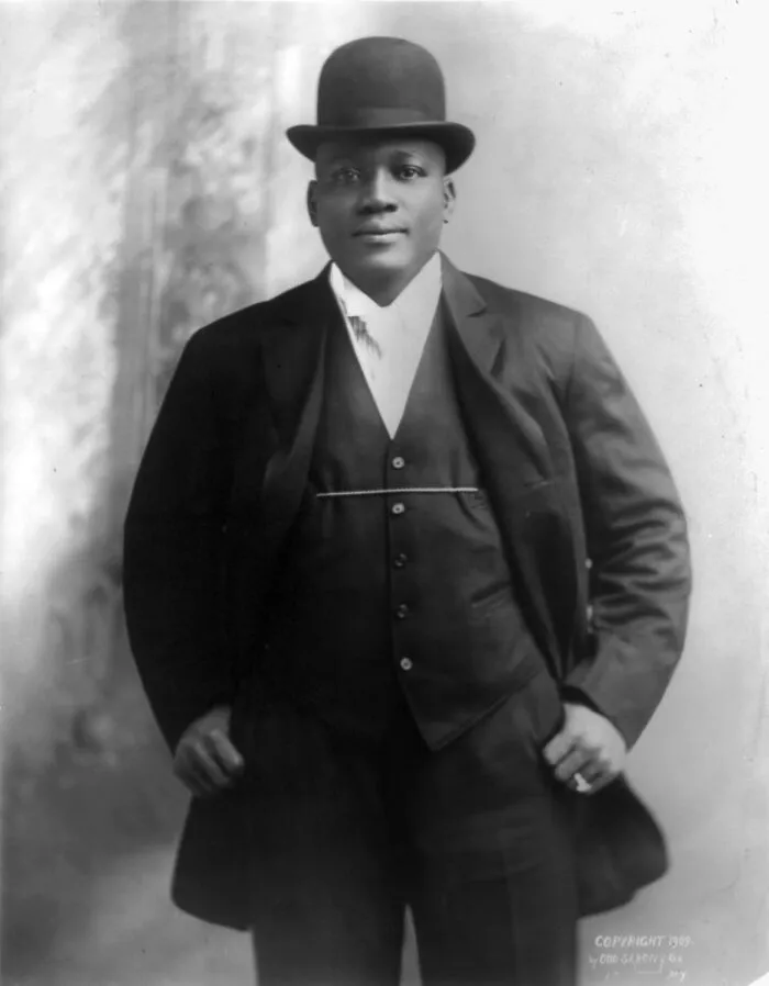 Portrait of a famous historical figure dressed in early 20th-century formal attire, showcasing good looks and style.