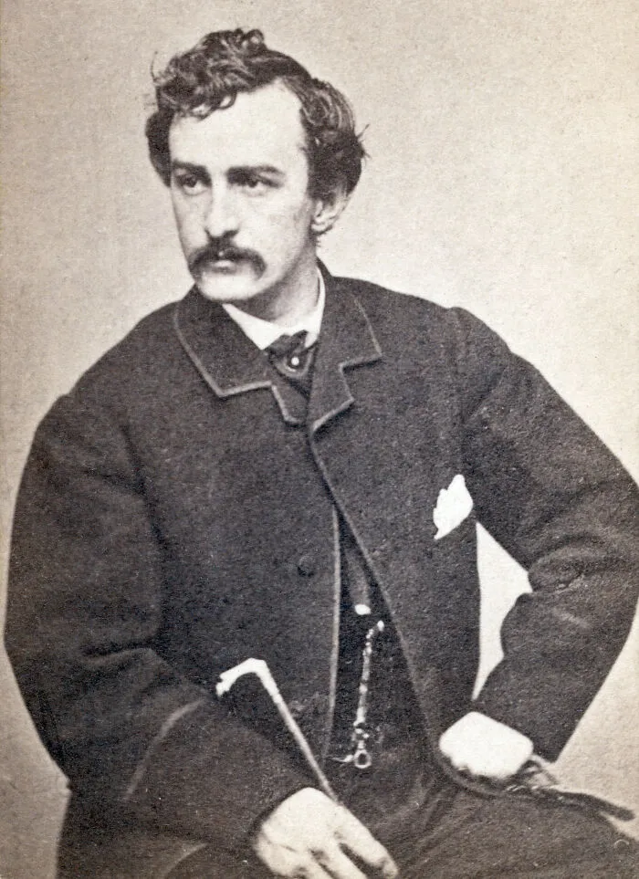 Vintage black and white portrait of a good looking man from history dressed in formal 19th century attire.