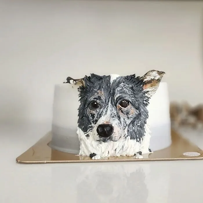 Pet-themed cake featuring a detailed and adorable dog portrait capturing its unique personality and charm.