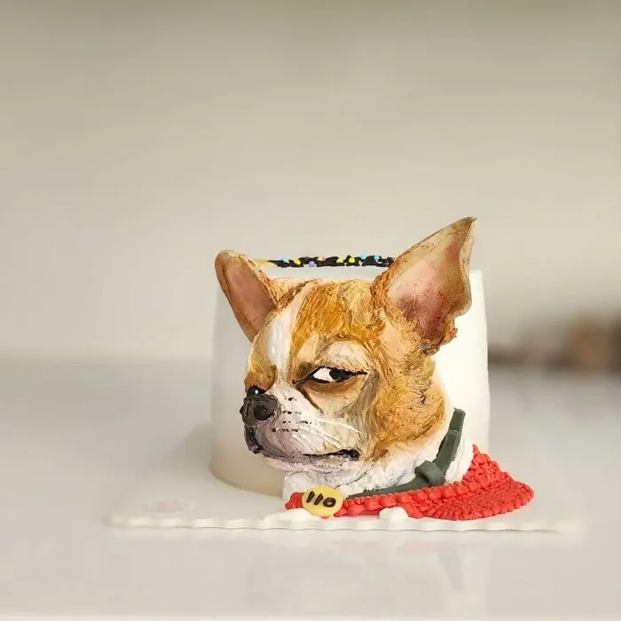 Pet-themed cake featuring a detailed dog face capturing its unique personality with realistic expression and vibrant colors.