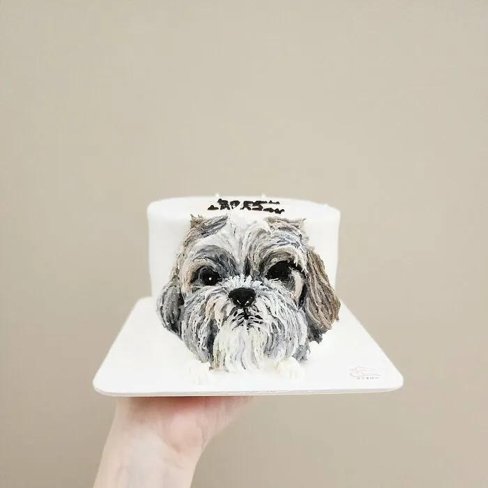Pet-themed cake designed to capture the unique personality of an adorable dog with realistic fur details.