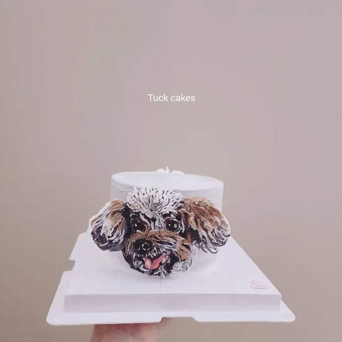 Pet-themed cake featuring a detailed and adorable dog face, showcasing unique personality in edible art.