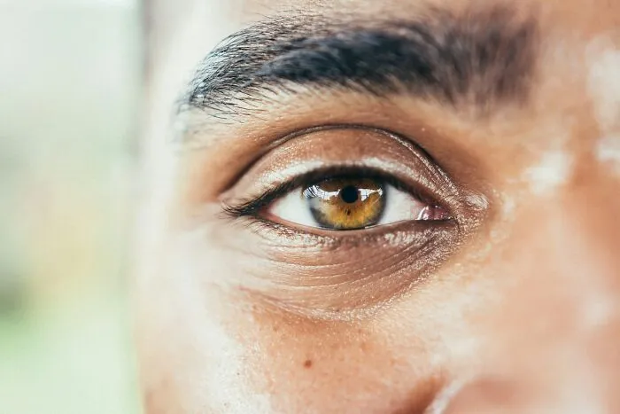 Close-up of a human eye representing intense emotions during insane hospital experiences in medical drama scenarios