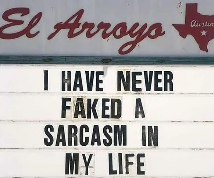 Humorous sign at El Arroyo restaurant with a sarcastic message adding chaos to the world.