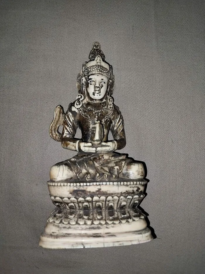 Small vintage statue found in walls and other hidden places in people’s homes, showcasing unexpected hidden objects.