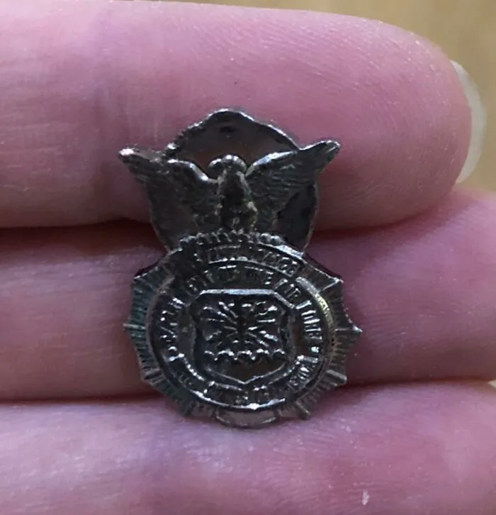 Small vintage police badge found among unexpected things hidden in walls and other secret places in homes.