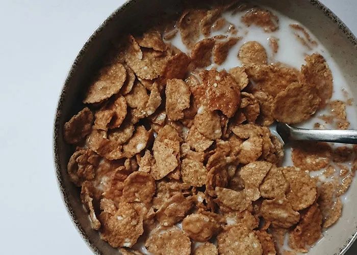 Bowl of cereal with milk representing healthy foods you might want to skip eating as shared by dentists and doctors online