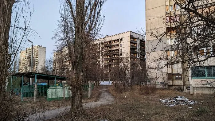 Abandoned explorers encounter creepy sights including dilapidated buildings and eerie empty streets in a forgotten urban area.