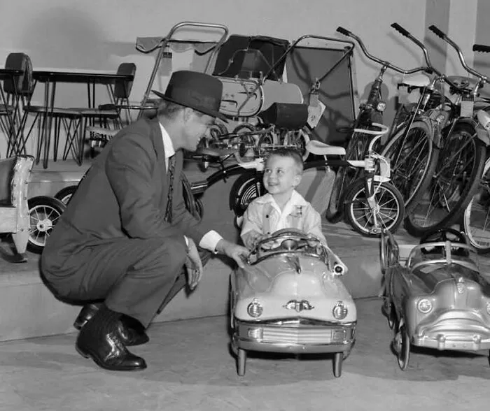 A Father Purchases A Pedal Car For His Son (1955)